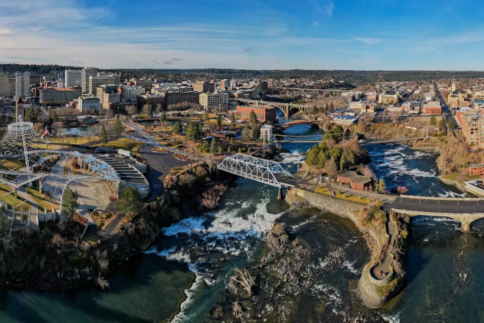 Aerial view of Spokane, Washington with river in foreground.